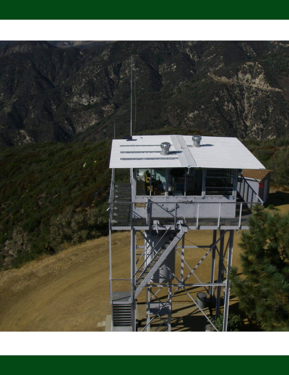 Standing atop a mountain tower offers a breathtaking perspective that extends far beyond the horizon.